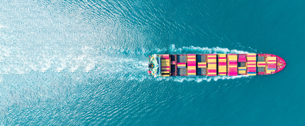 Aerial view of cargo ship with colorful containers